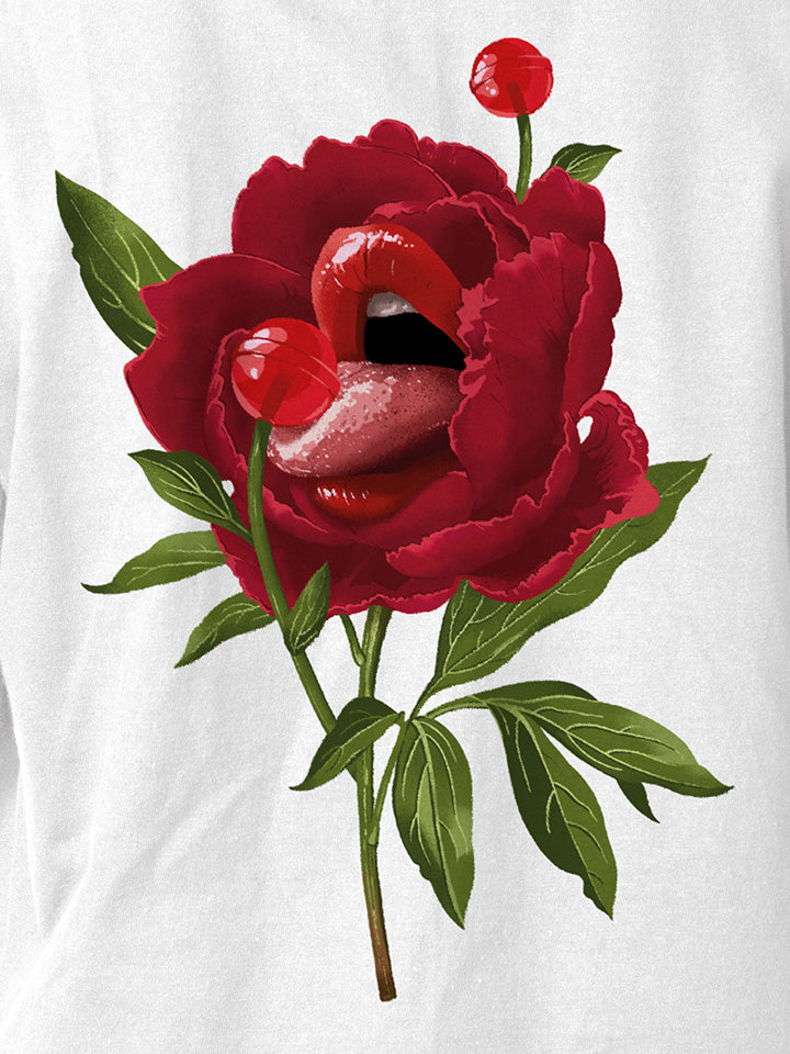 A close-up of a white printed t-shirt by useless treasures. Print of an illustrated red rose with big beautiful lips liking red candy flower.
