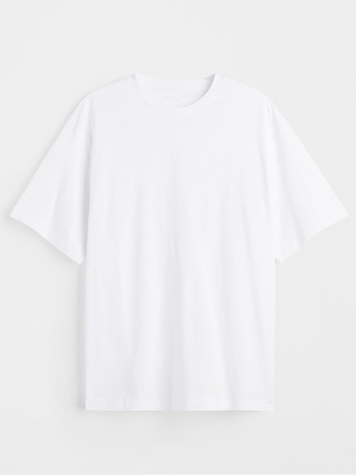 ​A back view to a blank organic oversize white t-shirt with the useless treasures logo. 