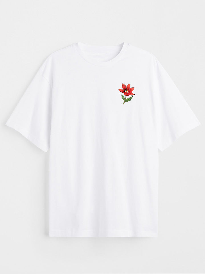 A front view of a white printed t-shirt by useless treasures. Print of an illustrated red flower with a yellow eye. 