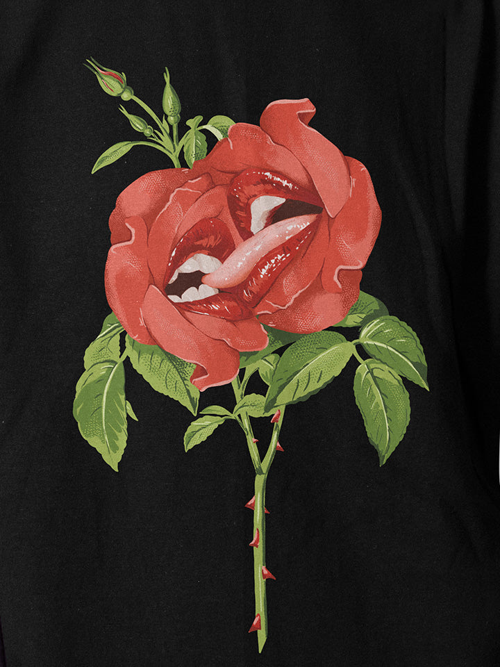 A close-up of a black printed t-shirt by useless treasures. Print of an illustrated red roses with big beautiful lips kissing.