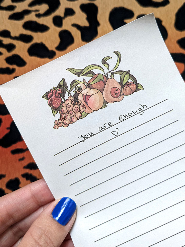 unique notepad with a humorous illustration decoration of different fruits as women's body parts, boobs and butts. 