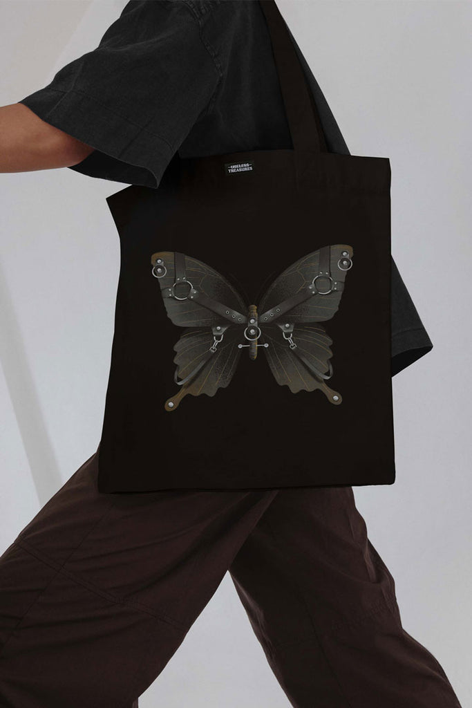 Printed black tote bag. Organic cotton shopping bag printed with useless treasures artwork. Black butterfly with harness and piercings 