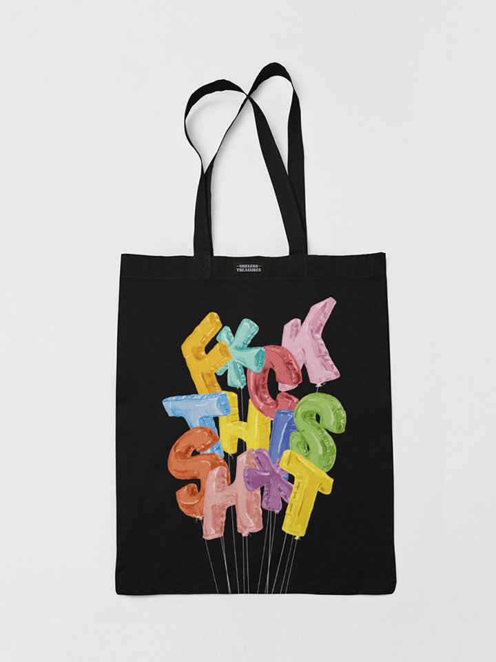 Printed black tote bag. Organic cotton shopping bag printed with useless treasures artwork. colorful balloons shaped like letters spelling Fuck this shit