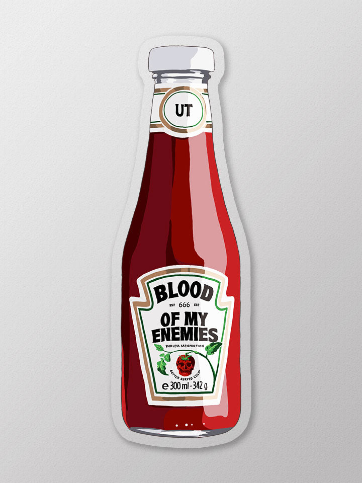 A sticker of a ketchup bottle with a sentence in the middle  that says "blood of my enemies" - Art by useless treasures.