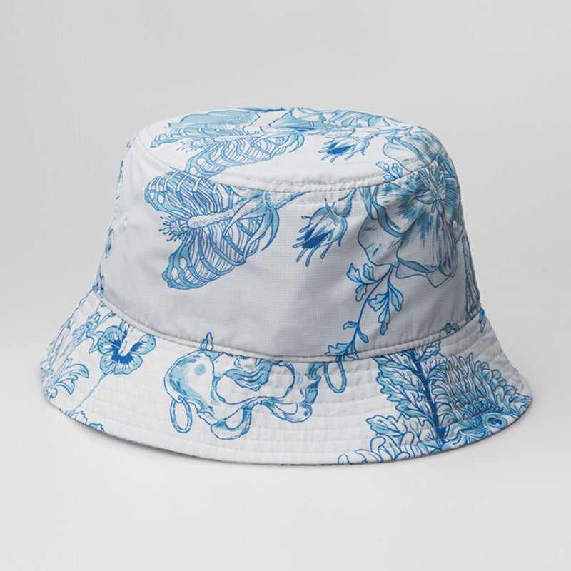 A white On & Off x Useless Treasures bucket hat with a screen print of blue flowers - designed by useless treasures.