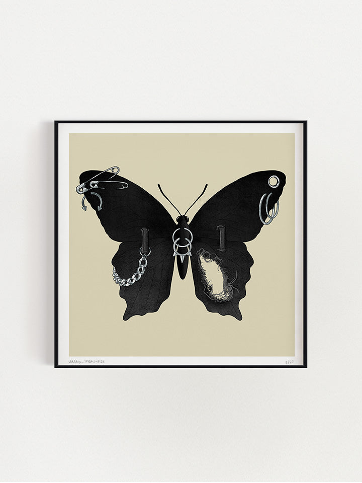 An illustration of a black Butterfly with wings made of black jeans with a tear in one wing and silver chain on the other wings connected to the jeans belt hops. It also has earrings like safety pins and piercing on top of a beige background- Art by useless treasures.