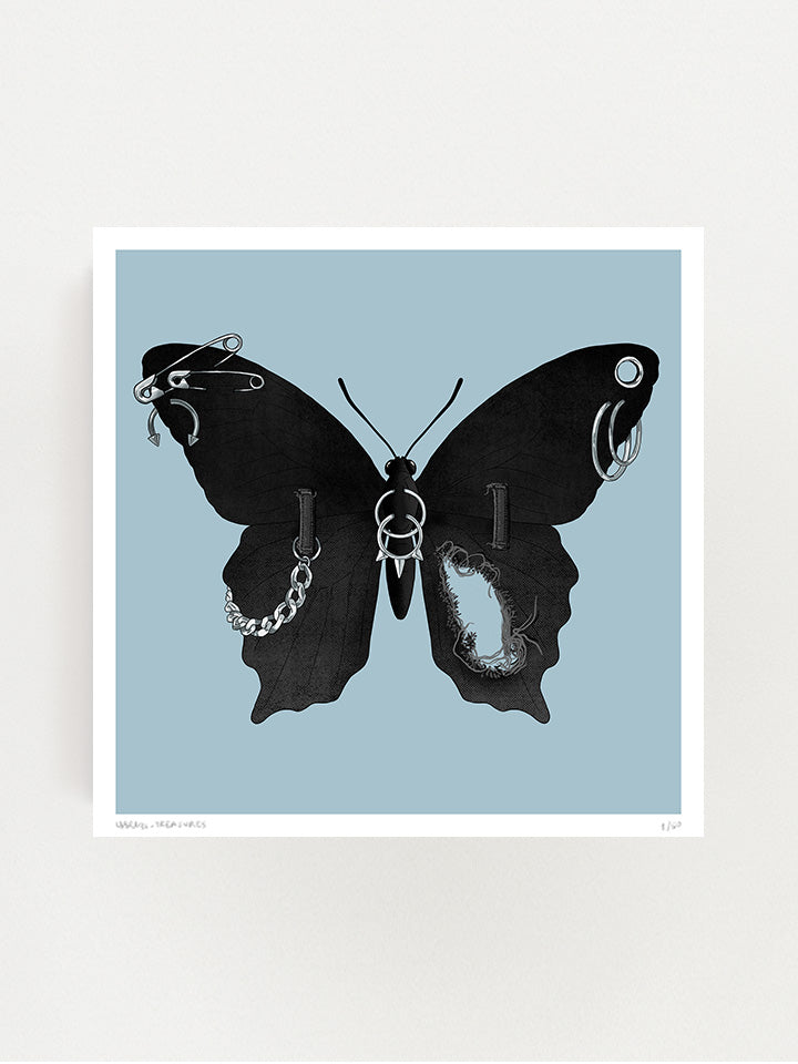 An illustration of a black Butterfly with wings made of black jeans with a tear in one wing and a silver chain on the other wings connected to the jeans belt hops. It also has earrings like safety pins and piercing on top of a light blue background- Art by useless treasures.