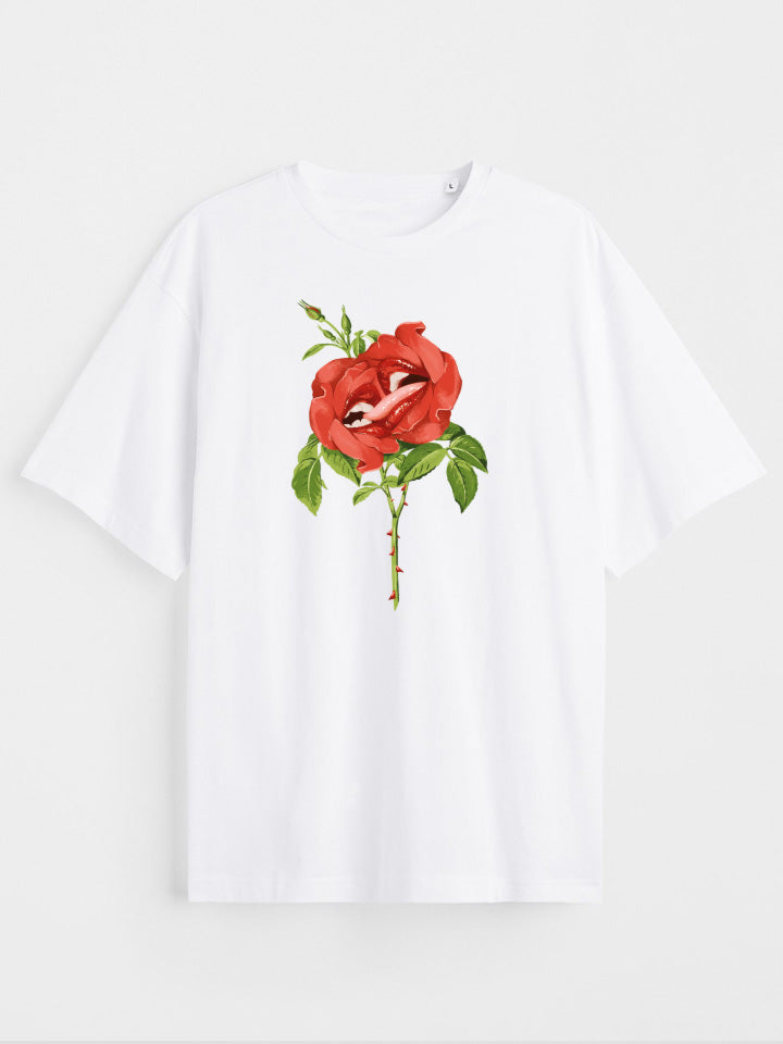 A White oversize printed T-shirt. Short sleeve Shirt with a print called "sweet nectar" of two red roses kissing Surreal illustration by useless treasures. Organic cotton, loose fit.